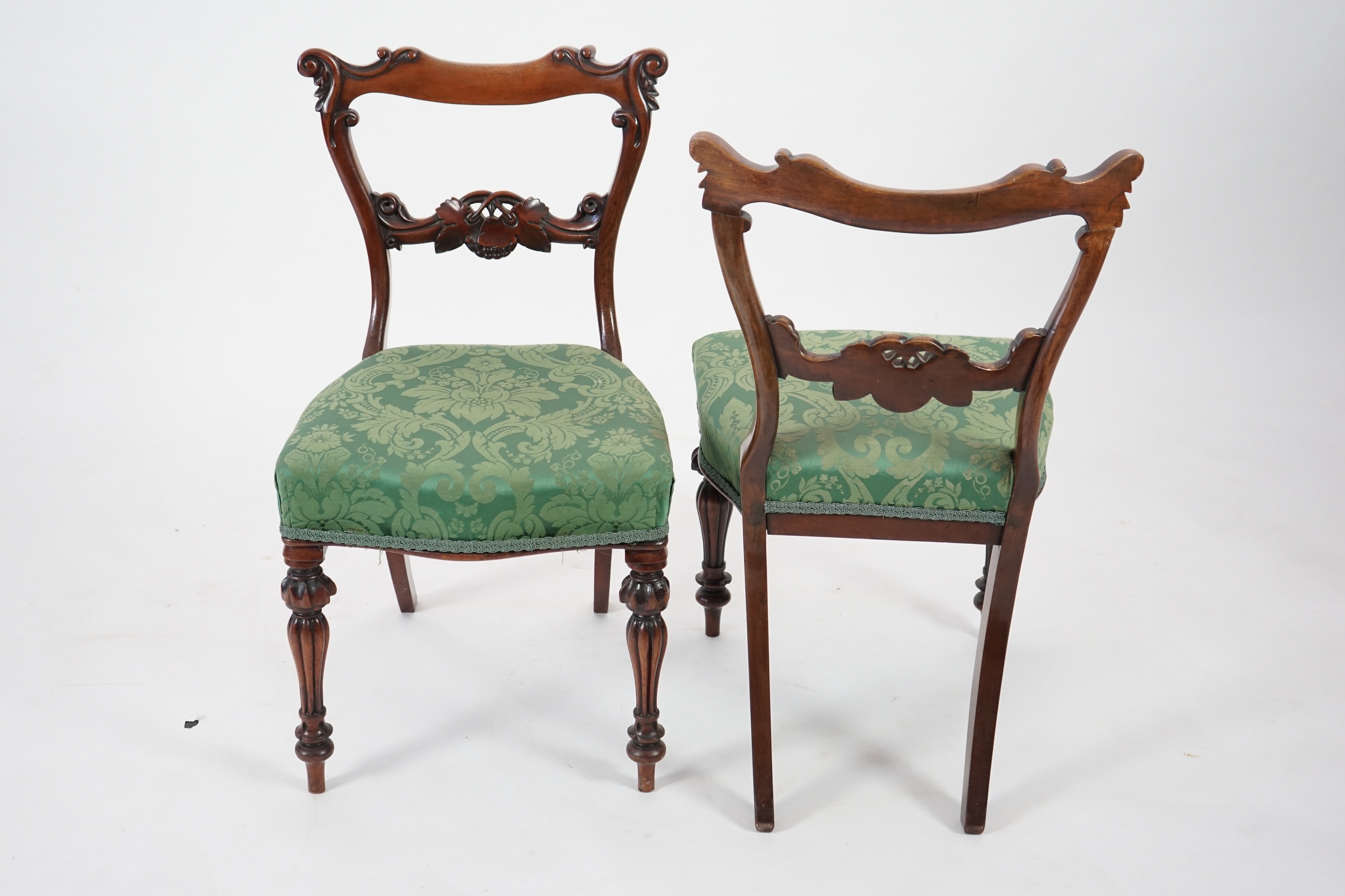 A pair early Victorian mahogany buckle back dining chairs